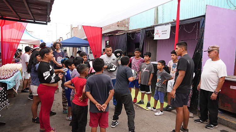 Image of youth receiving lesson in self-defense