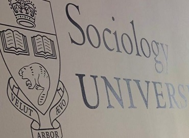 A coat of arms displaying a crown, two books, and a beaver, with the Latin phrase "Velut arbor aevo," to the right of the words "Sociology" and "University of Toronto"