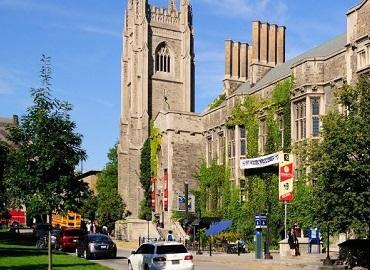 Hart House main tower with traffic in front